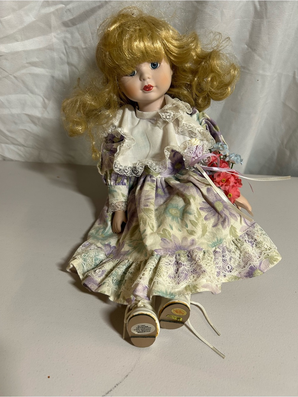 Blonde Porcelain Doll in Purple Floral Dress - Decorative Kids Toy